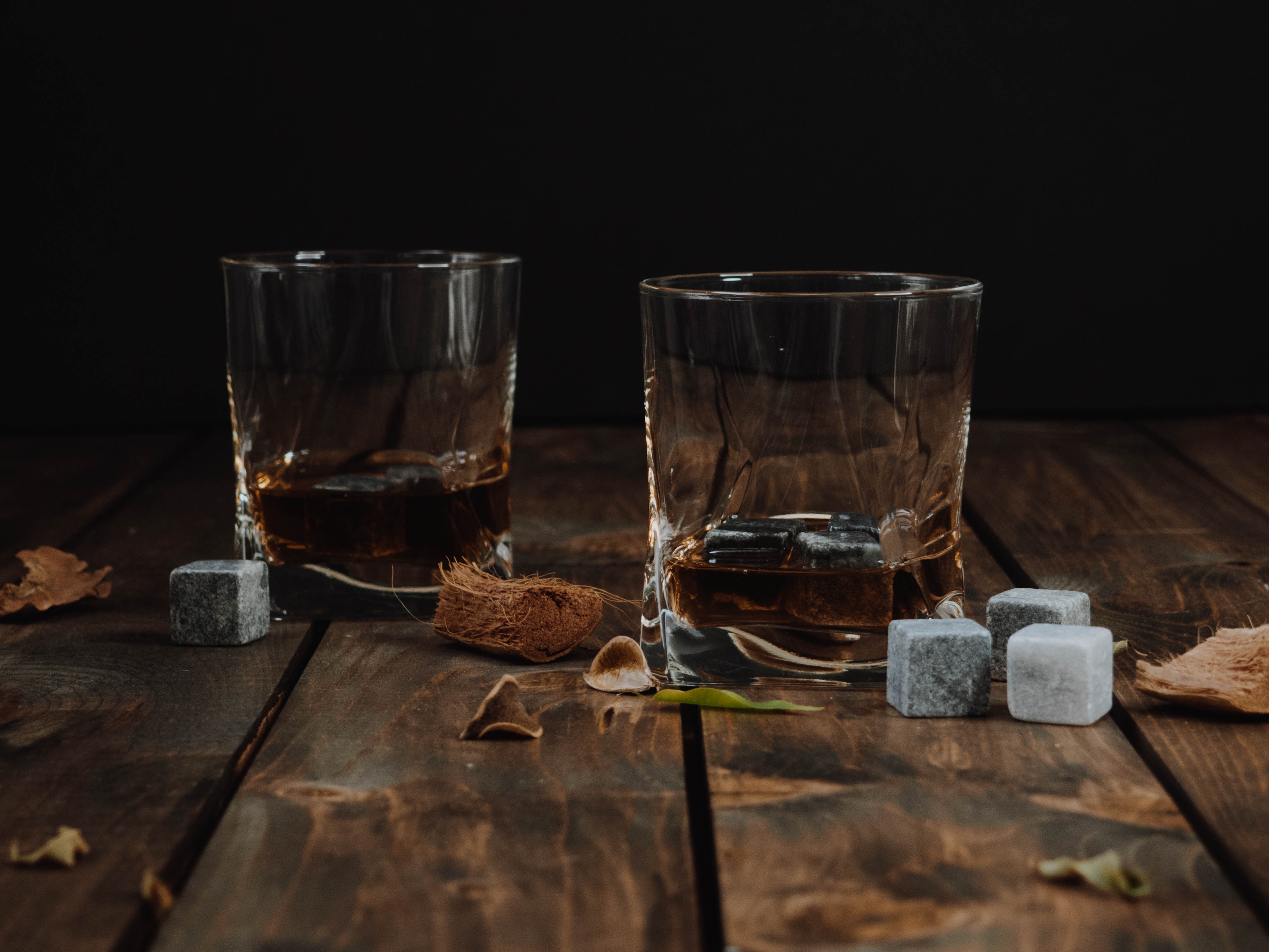 Bourbon in neat glasses with chilling stones