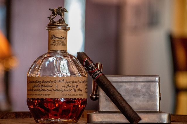 Blanton's Bourbon Bottle and a Cigar on a bar top